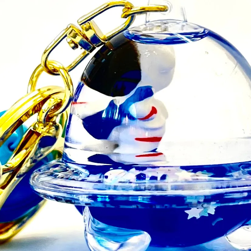 12102 ASTRONAUT UFO FLOATY KEY CHARM-12
